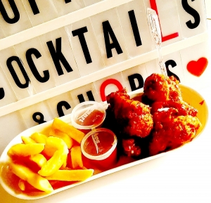Spicy Chicken Wings and Fries in Lagos